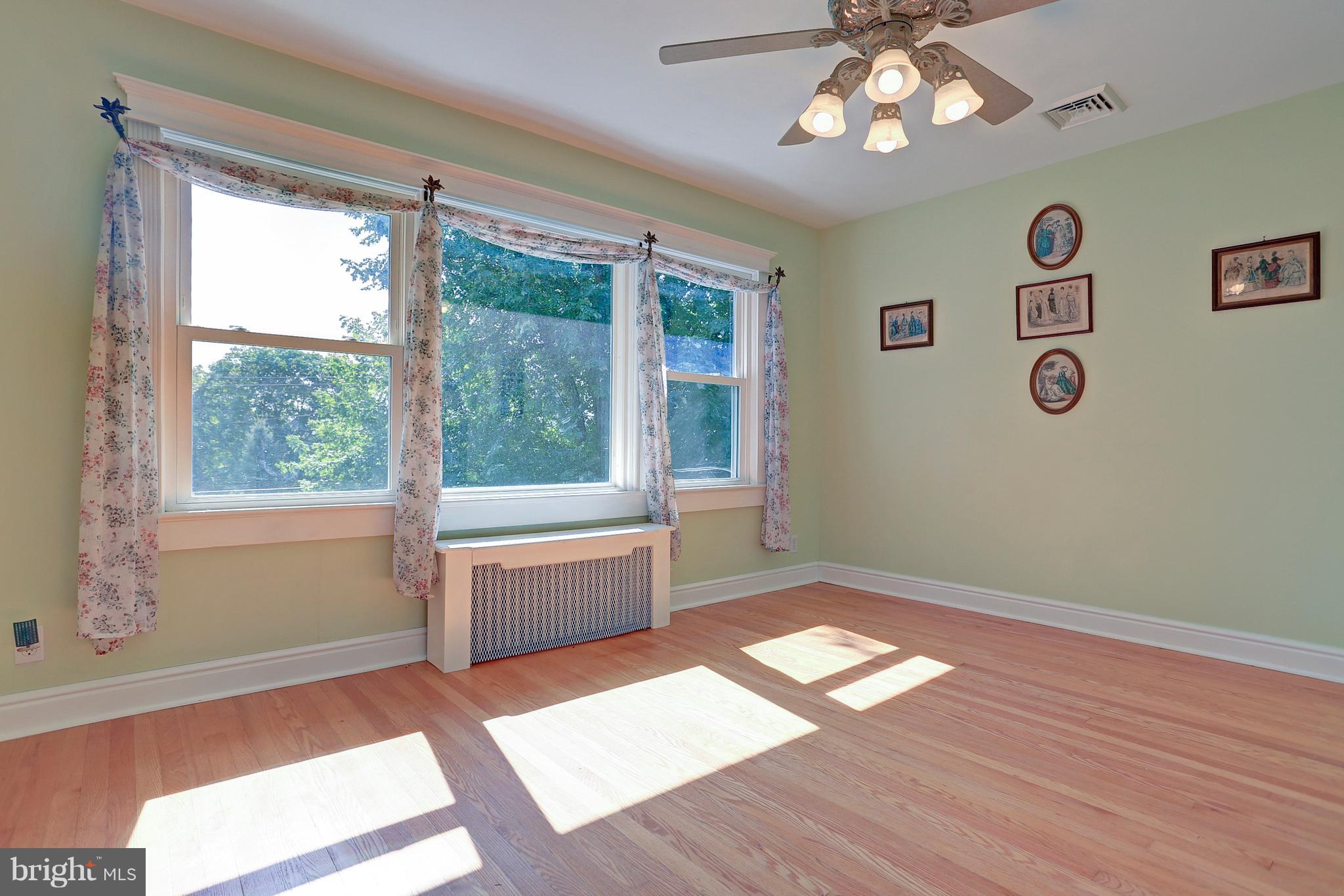 425 Corbin Road York, PA 17403 - Photo 7 of 49 a spacious bedroom with a large bed and a window