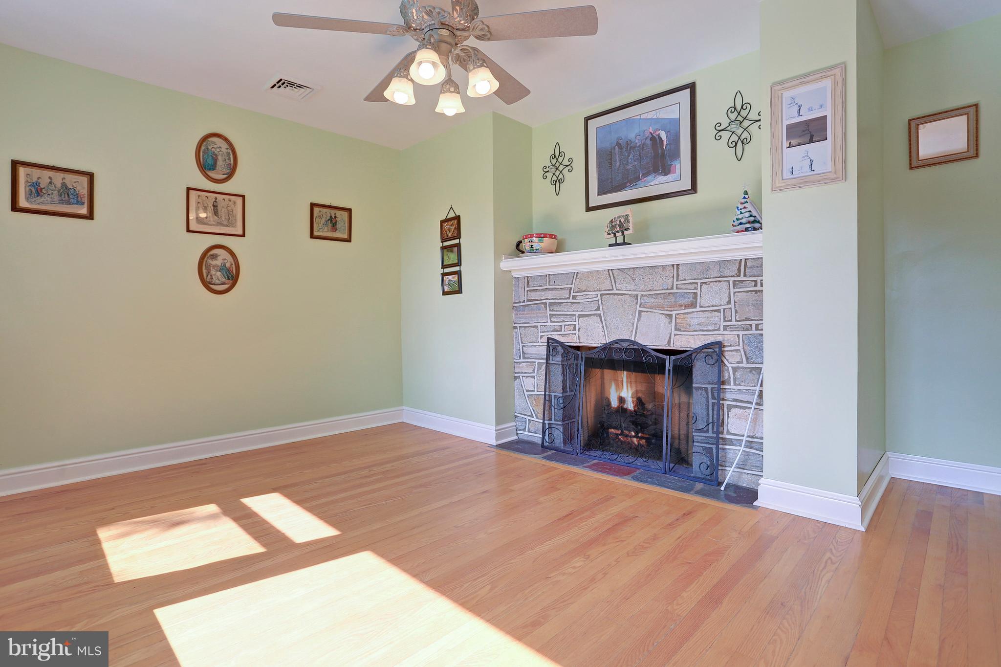 425 Corbin Road York, PA 17403 - Photo 8 of 49 a room with painting and a fireplace