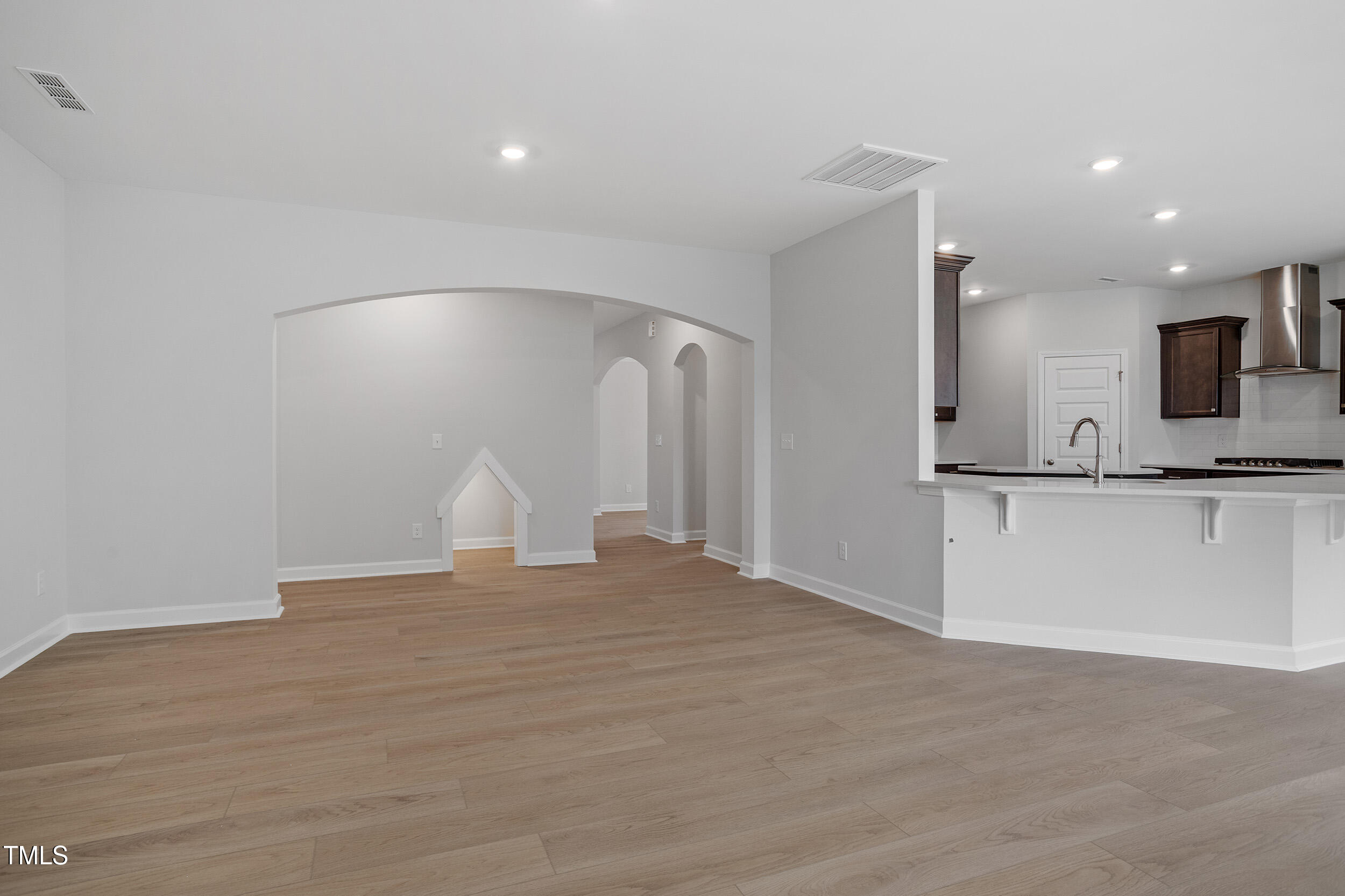 221 Savannah Moss Way, Unit 119 Raleigh, NC 27603 - Photo 11 of 41 a view of an empty room with kitchen and window