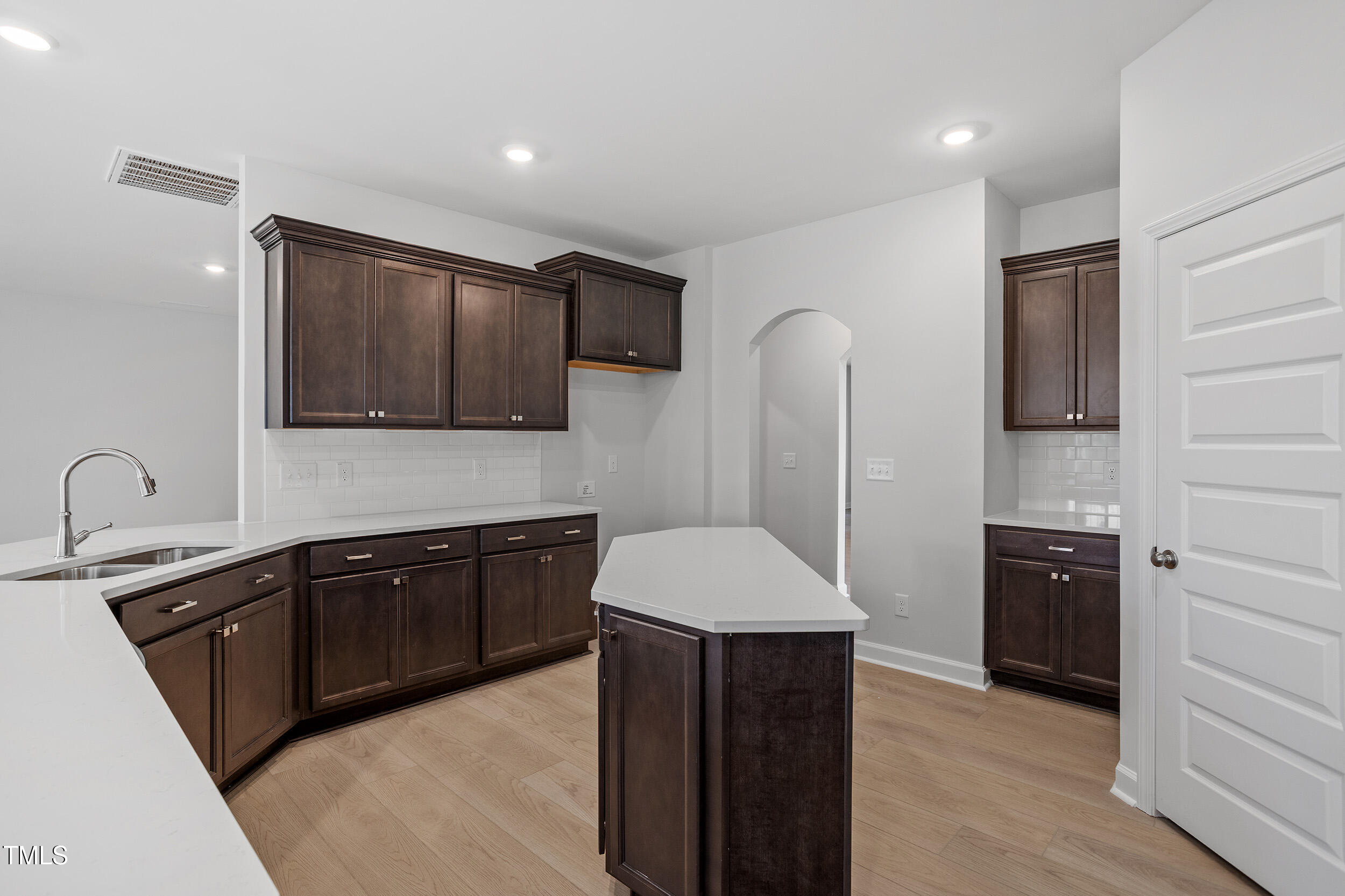 221 Savannah Moss Way, Unit 119 Raleigh, NC 27603 - Photo 16 of 41 a kitchen with a sink stove and refrigerator