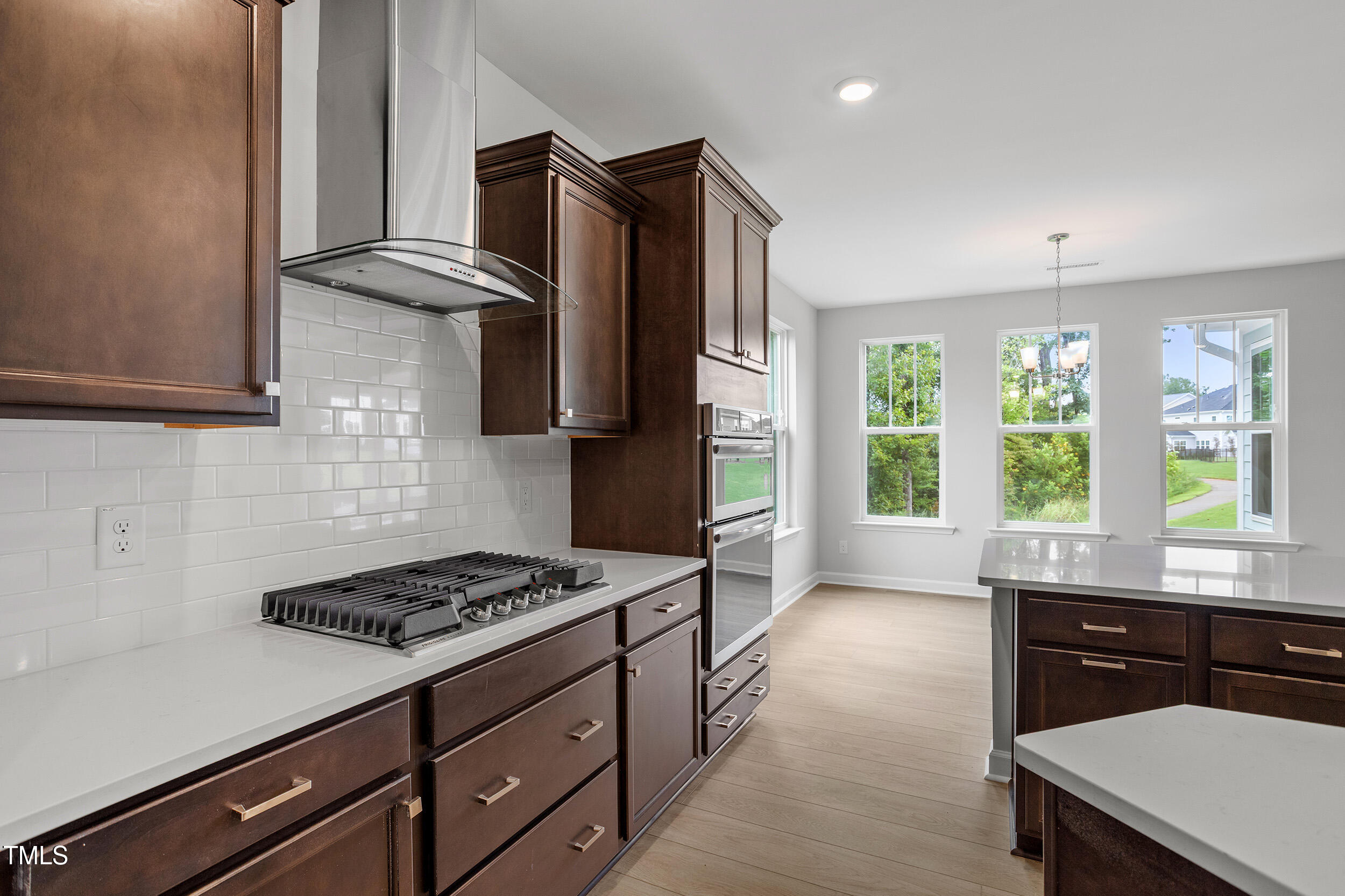 221 Savannah Moss Way, Unit 119 Raleigh, NC 27603 - Photo 17 of 41 a kitchen with a stove a sink and a refrigerator
