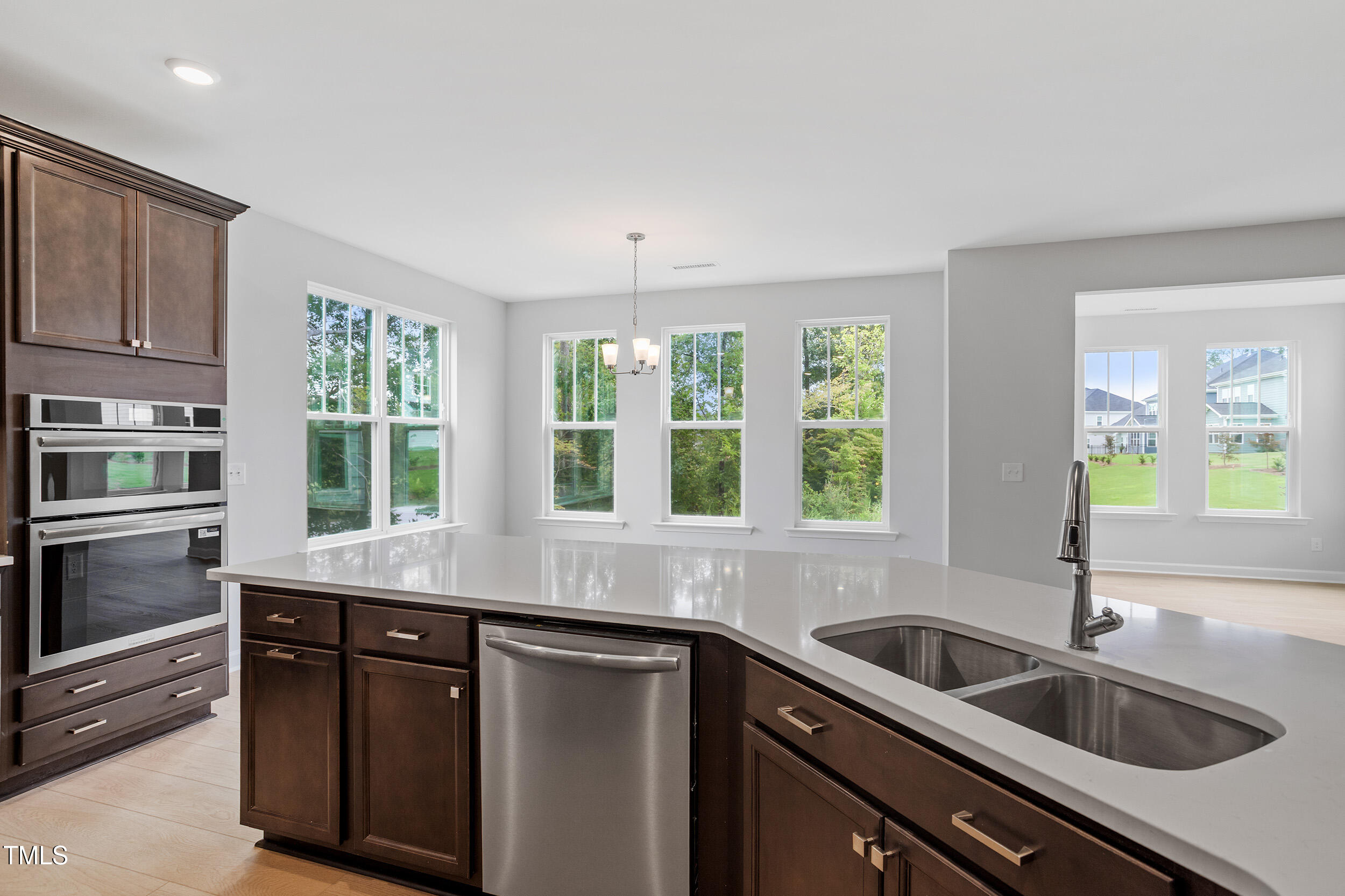 221 Savannah Moss Way, Unit 119 Raleigh, NC 27603 - Photo 19 of 41 a kitchen with stainless steel appliances granite countertop a sink and a granite counter tops