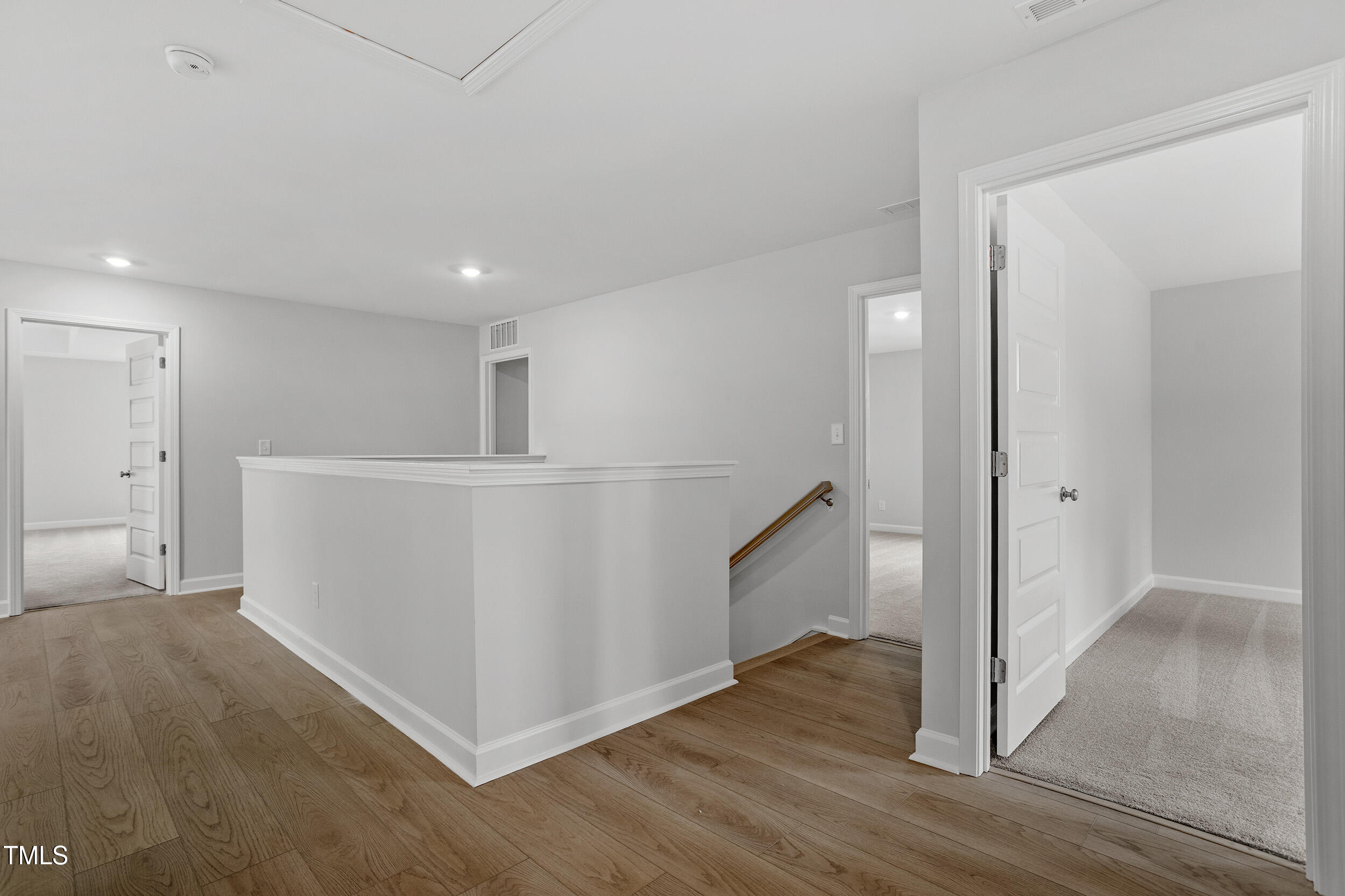 221 Savannah Moss Way, Unit 119 Raleigh, NC 27603 - Photo 22 of 41 a view of a hallway with wooden floor