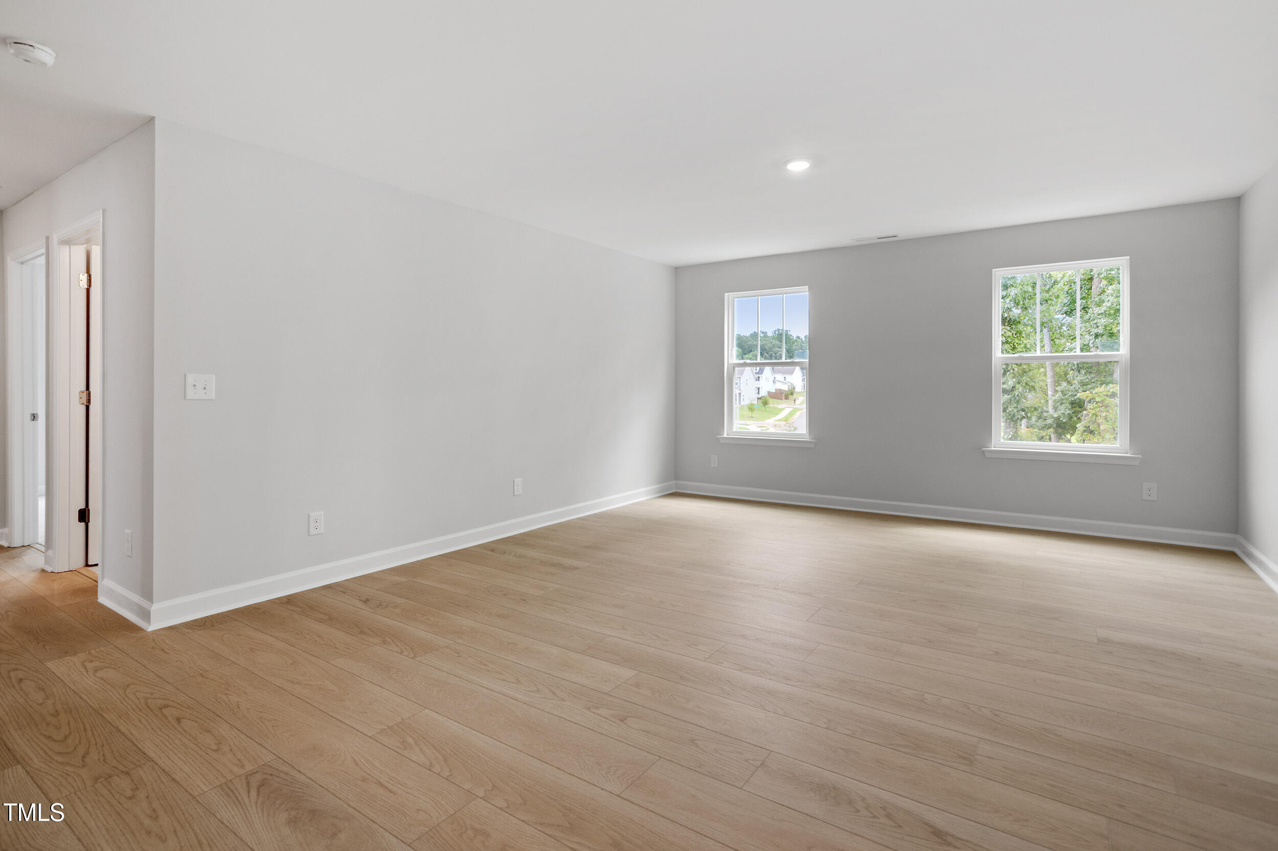 221 Savannah Moss Way, Unit 119 Raleigh, NC 27603 - Photo 23 of 41 an empty room with windows and closet