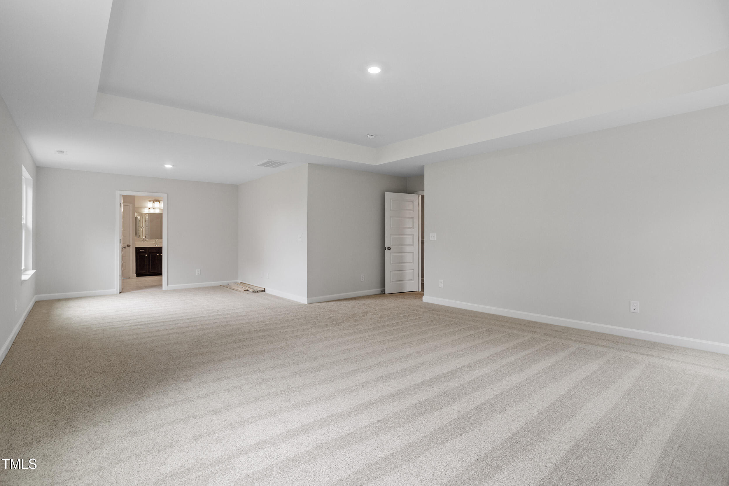 221 Savannah Moss Way, Unit 119 Raleigh, NC 27603 - Photo 26 of 41 a view of an empty room with wooden floor