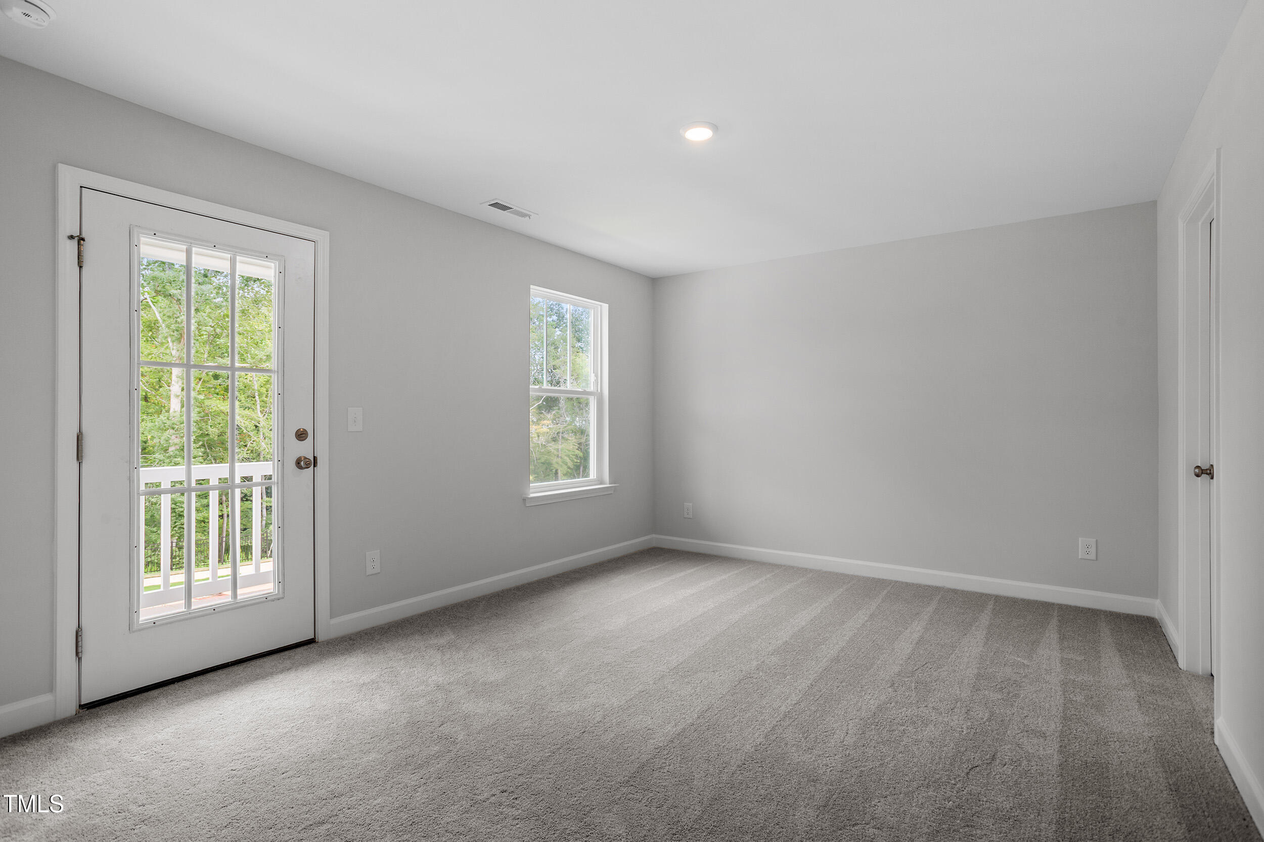 221 Savannah Moss Way, Unit 119 Raleigh, NC 27603 - Photo 30 of 41 a view of an empty room with a window