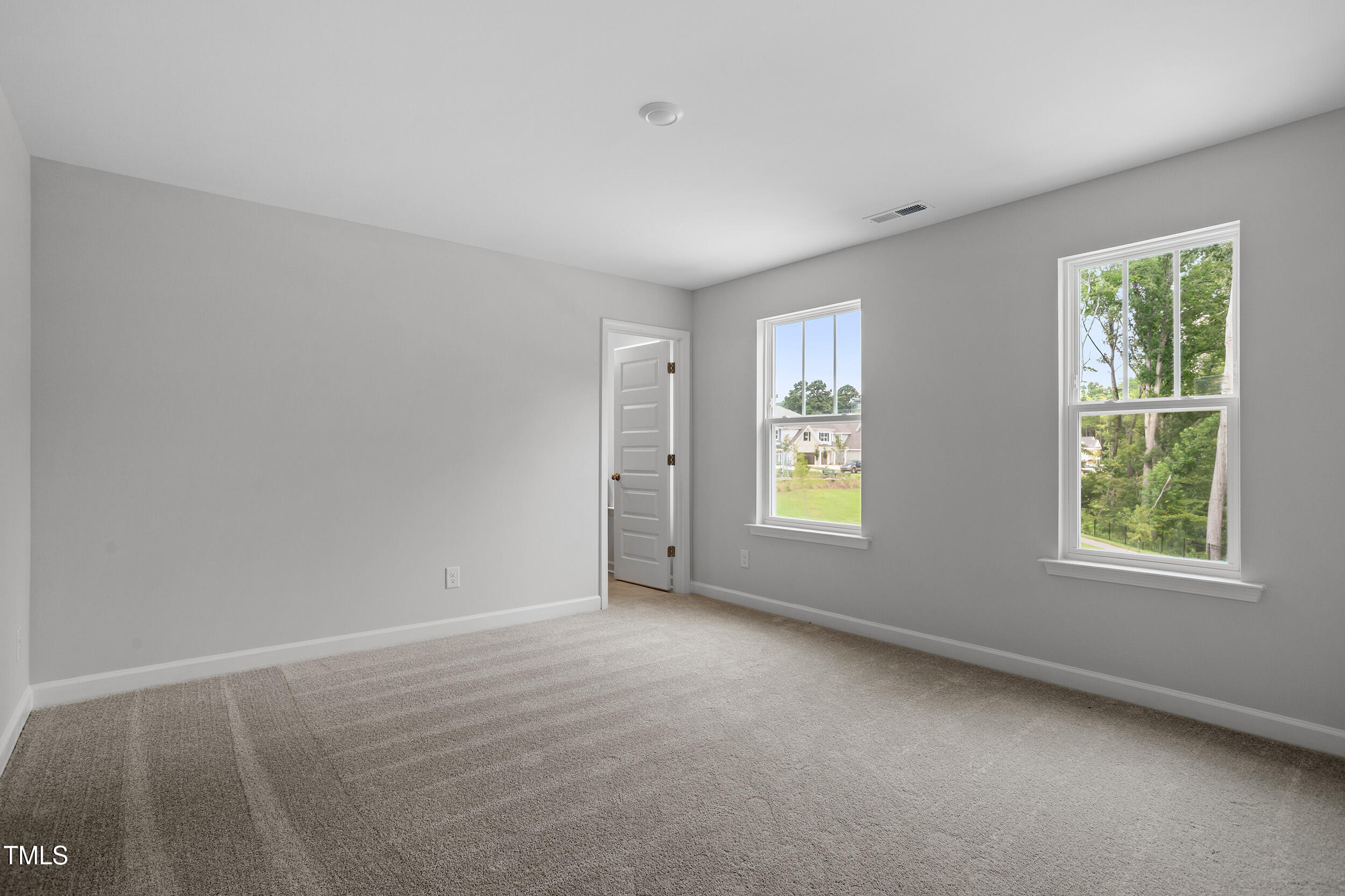 221 Savannah Moss Way, Unit 119 Raleigh, NC 27603 - Photo 33 of 41 an empty room with windows