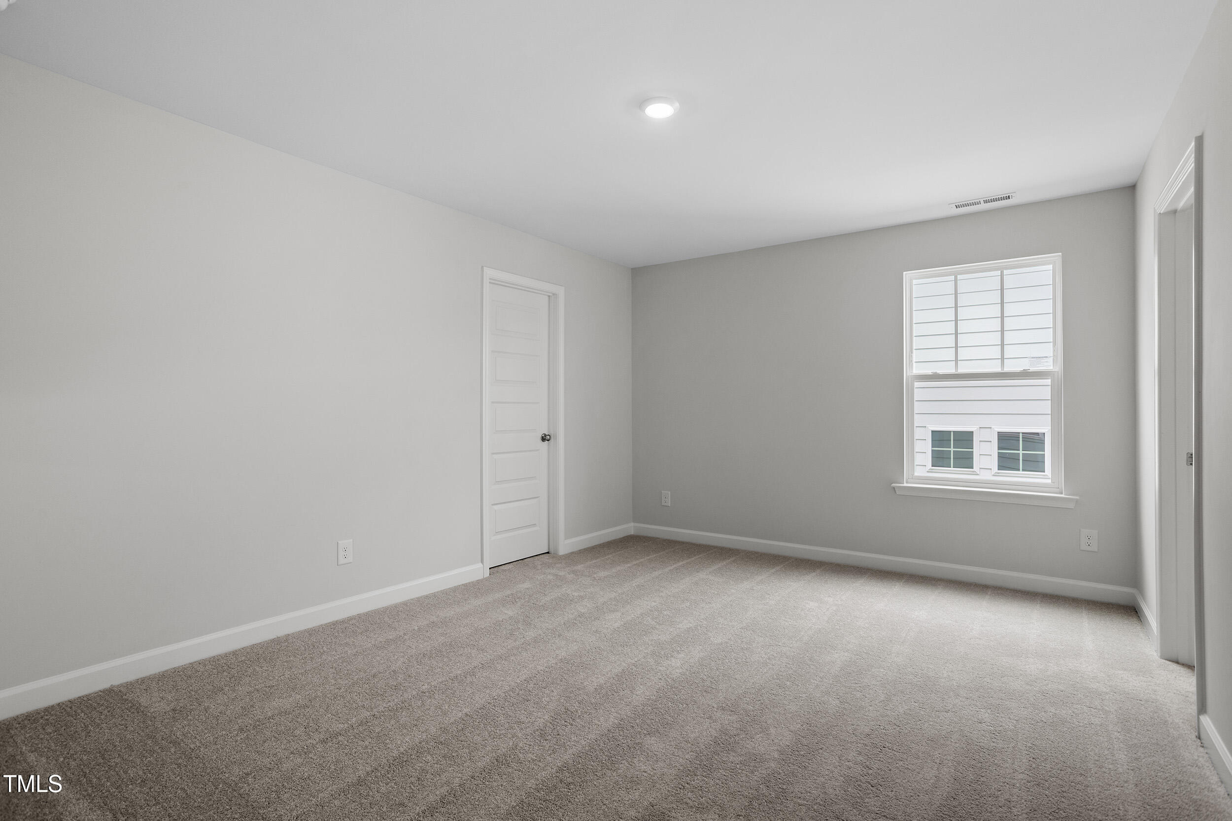 221 Savannah Moss Way, Unit 119 Raleigh, NC 27603 - Photo 34 of 41 an empty room with windows