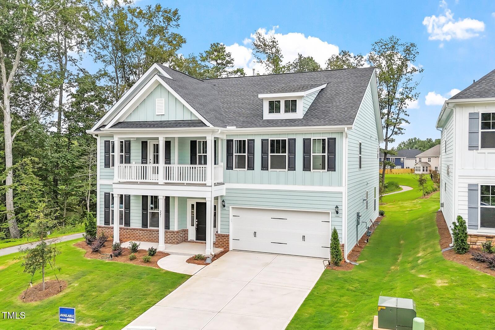 221 Savannah Moss Way, Unit 119 Raleigh, NC 27603 - Photo 3 of 41 a front view of a house with a yard