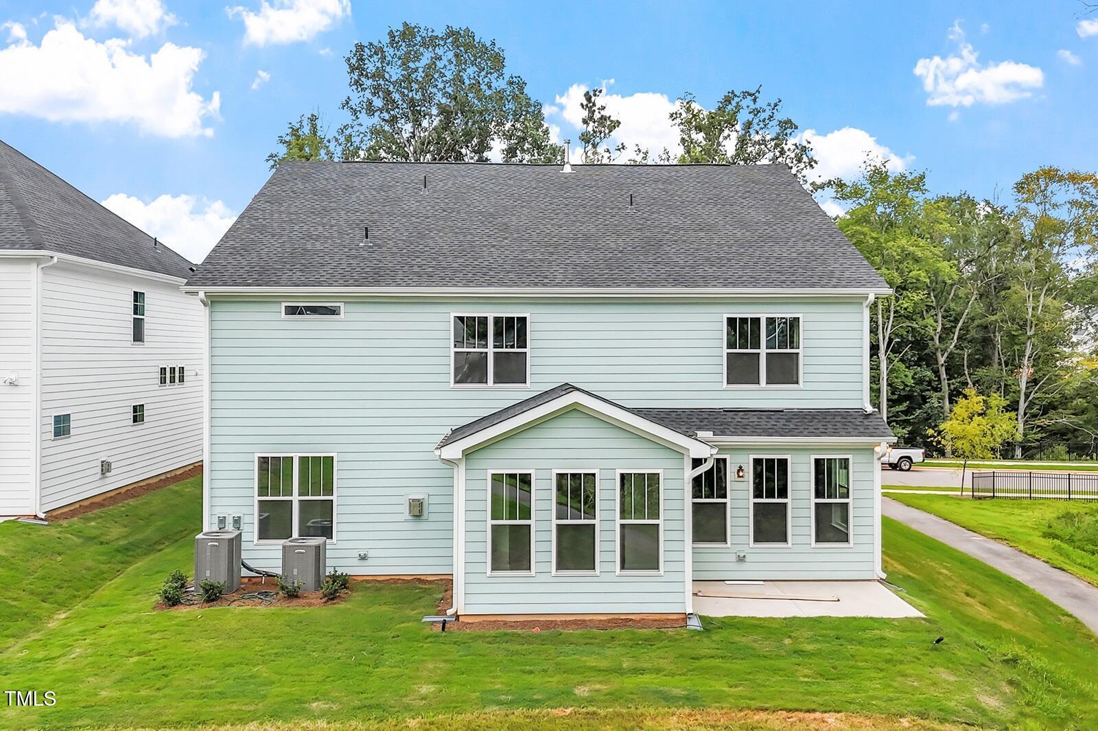 221 Savannah Moss Way, Unit 119 Raleigh, NC 27603 - Photo 4 of 41 a front view of a house with a garden