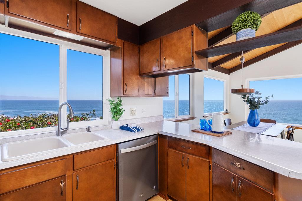 101 Lilly Way La Selva Beach, CA 95076 - Photo 23 of 57 a kitchen with a sink and cabinets