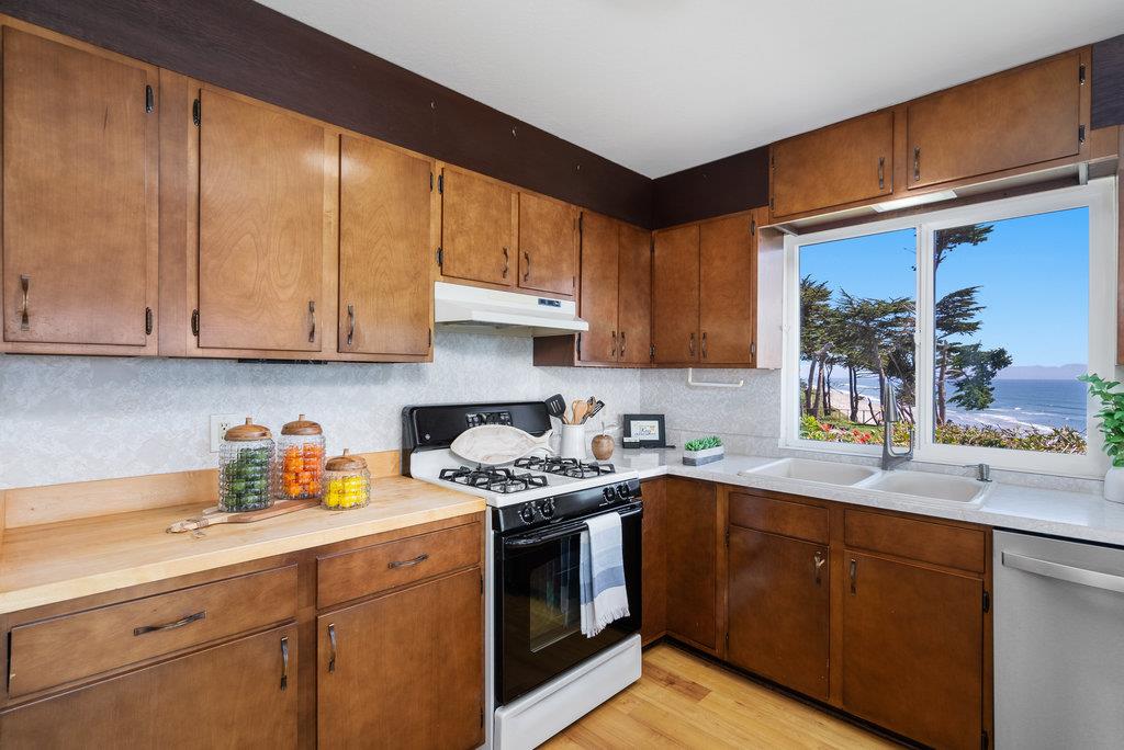 101 Lilly Way La Selva Beach, CA 95076 - Photo 24 of 57 a kitchen with stainless steel appliances granite countertop a sink stove and cabinets