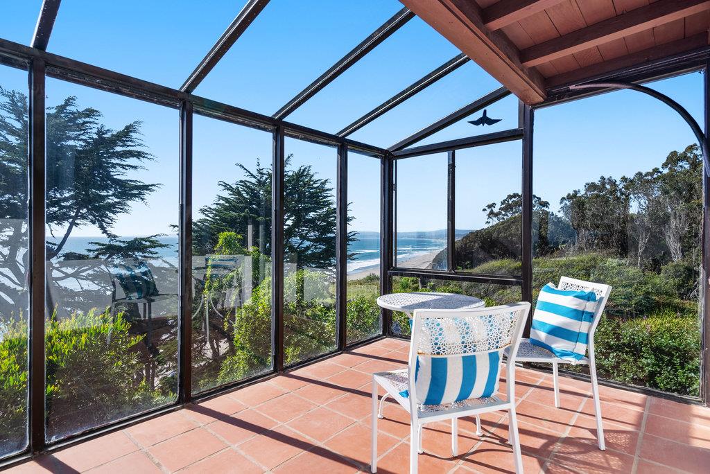 101 Lilly Way La Selva Beach, CA 95076 - Photo 41 of 57 a patio with table and chairs and potted plants