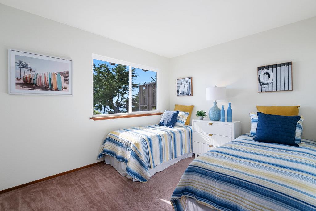 101 Lilly Way La Selva Beach, CA 95076 - Photo 44 of 57 a bedroom with two beds and a painting on the wall