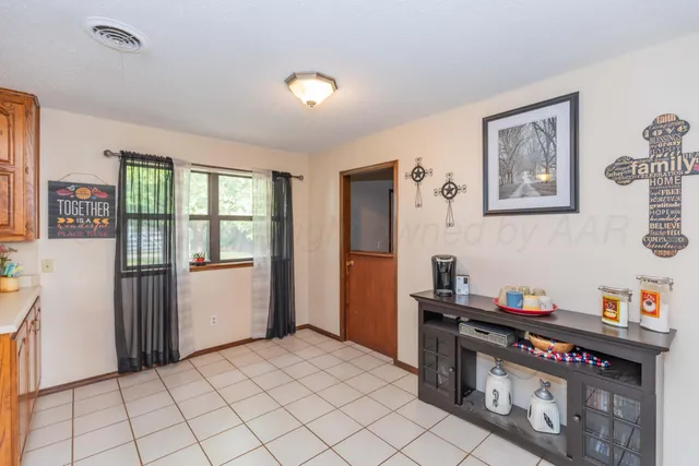 a kitchen that has a stove and a table in it