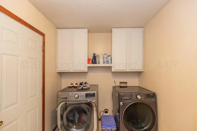 a view of kitchen sink and washer dryer
