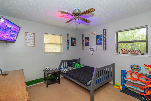 a bedroom with furniture and a window