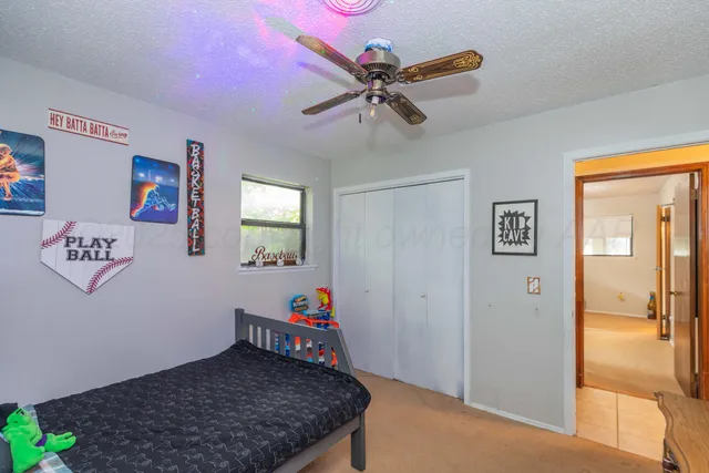 a bedroom with a bed and furniture