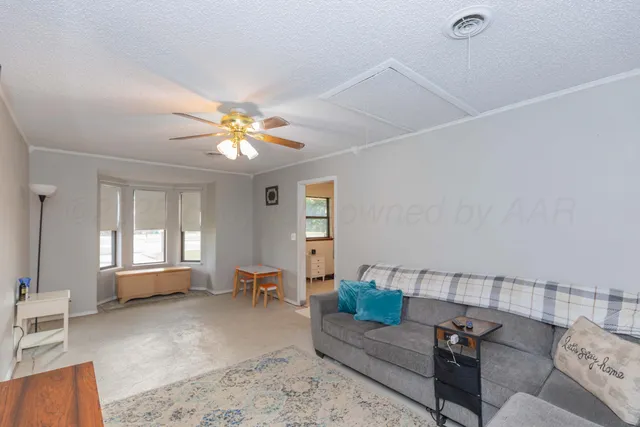 a living room with furniture and window