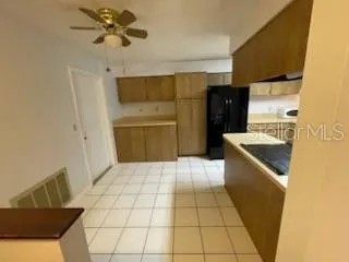 a kitchen with a sink a stove and refrigerator