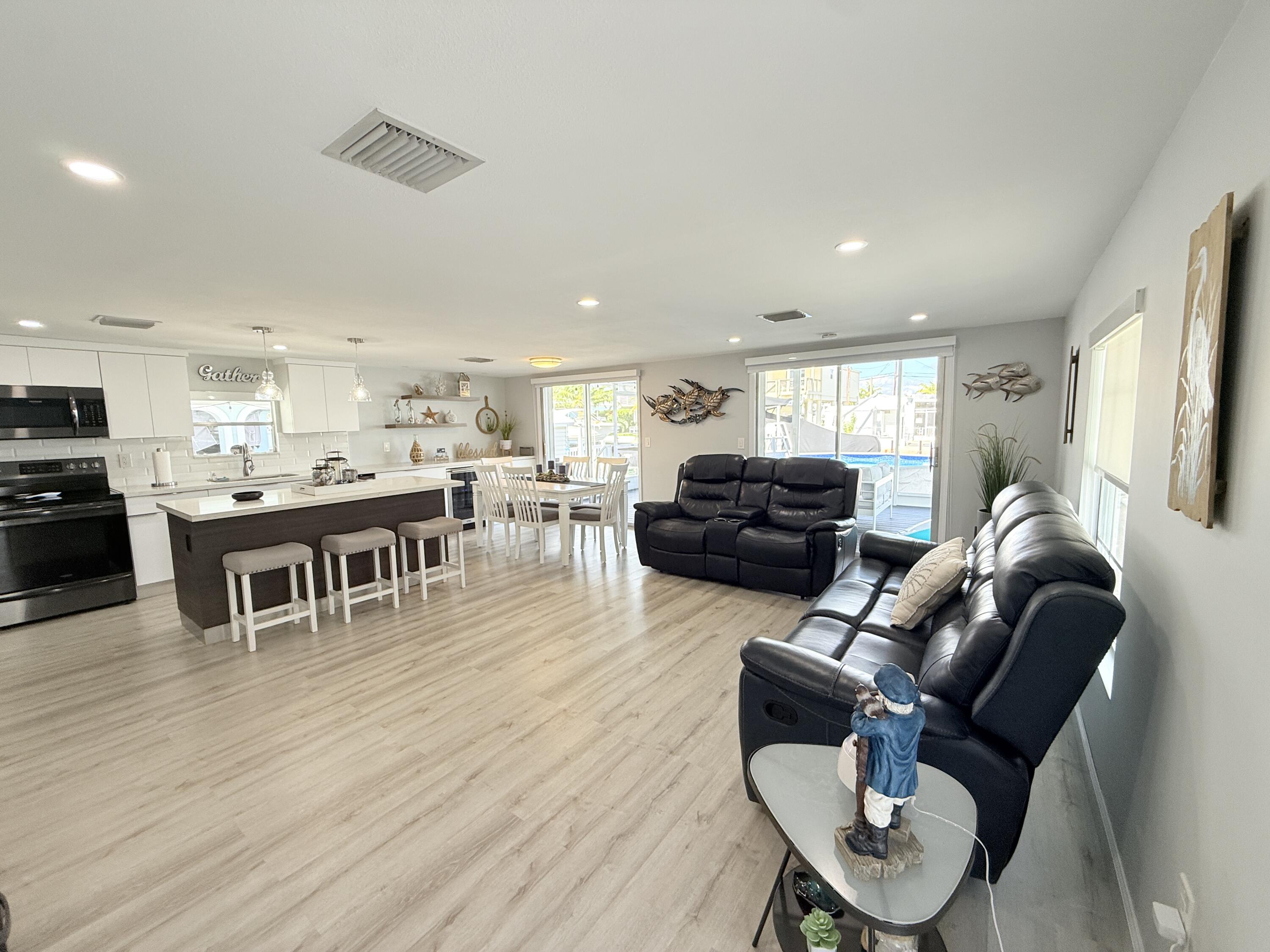 505 Oldsmar Lane Key Largo, FL 33037 - Photo 12 of 61 a living room with furniture and a wooden floor
