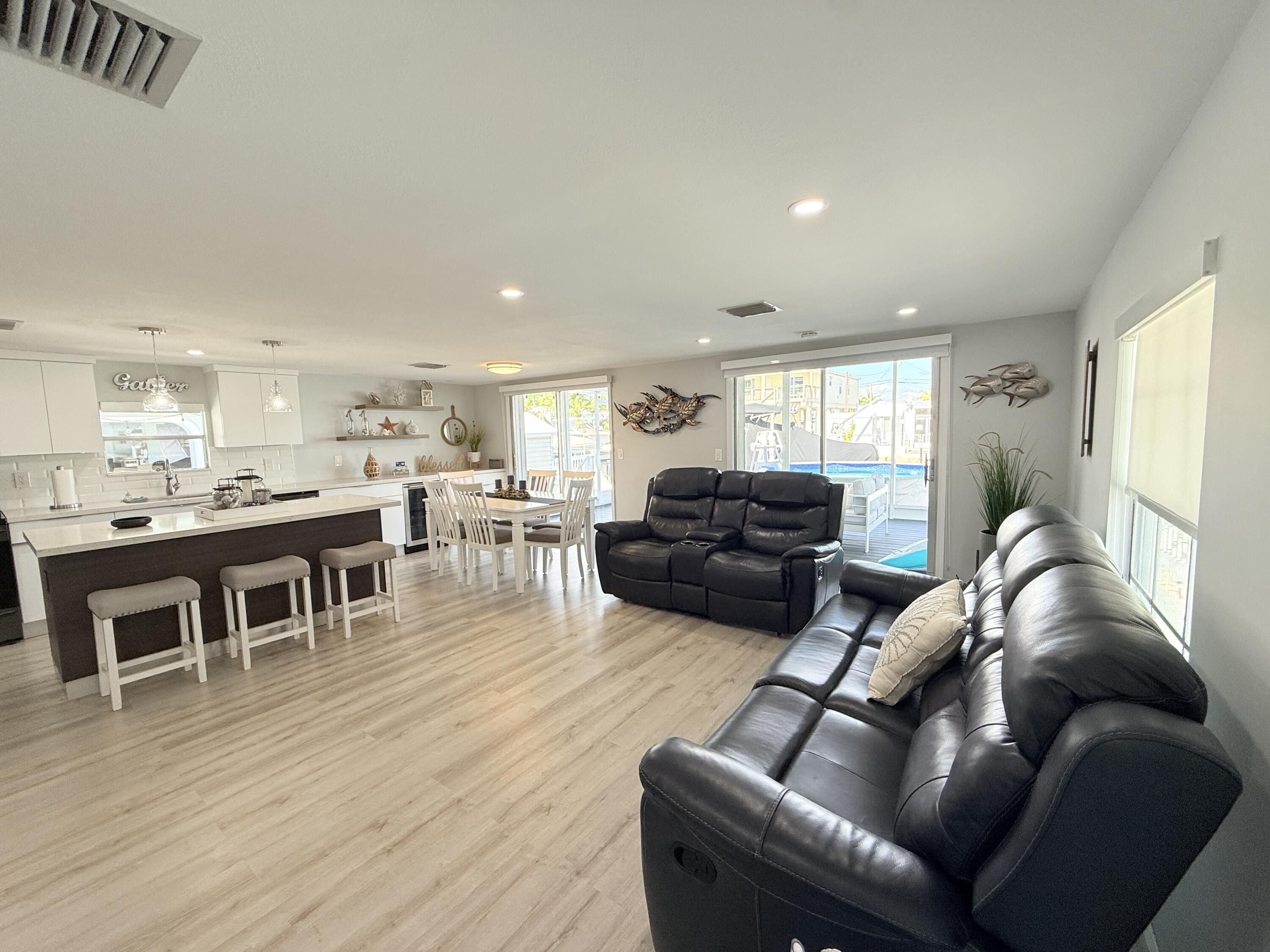 505 Oldsmar Lane Key Largo, FL 33037 - Photo 13 of 61 a living room with furniture and kitchen view