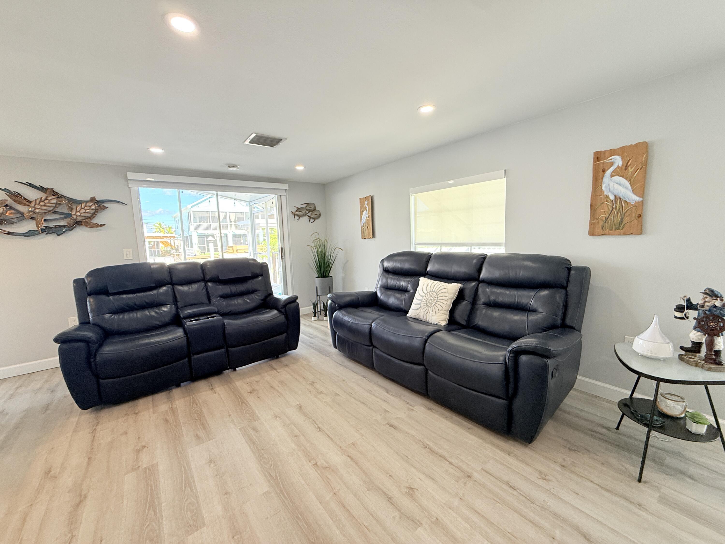 505 Oldsmar Lane Key Largo, FL 33037 - Photo 14 of 61 a living room with furniture window and a wooden floor