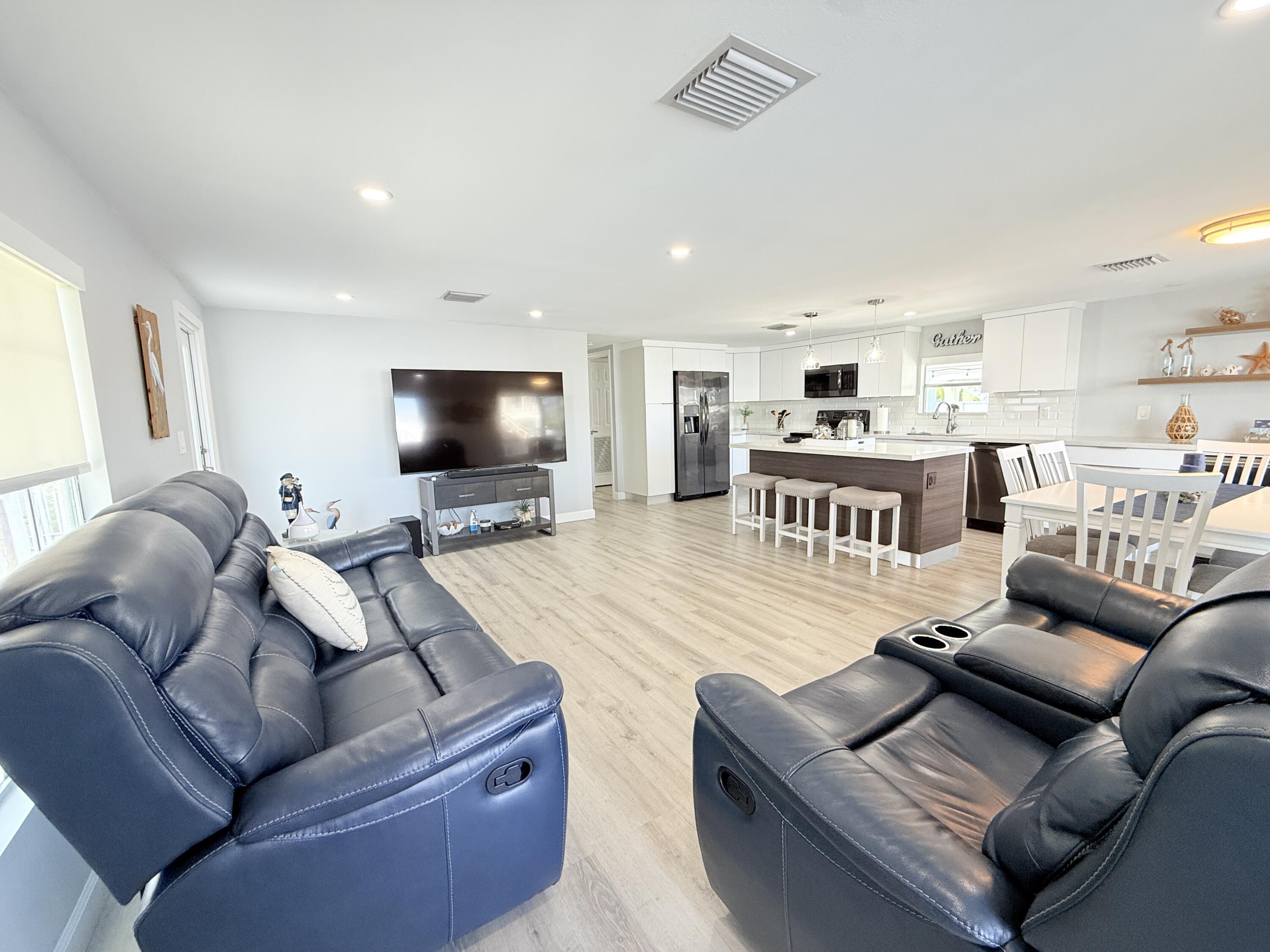 505 Oldsmar Lane Key Largo, FL 33037 - Photo 15 of 61 a living room with furniture and a flat screen tv