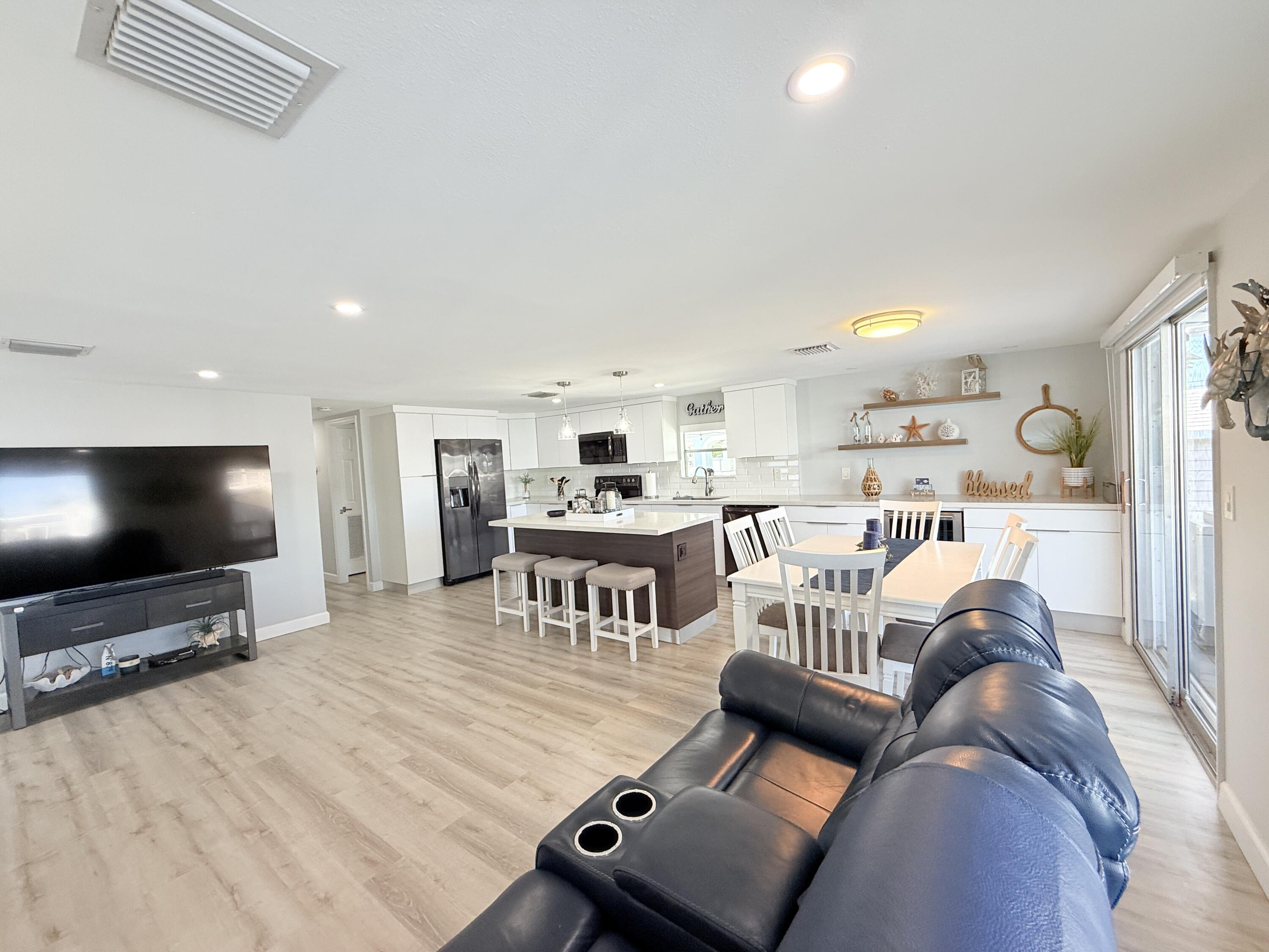 505 Oldsmar Lane Key Largo, FL 33037 - Photo 16 of 61 a living room with furniture and a flat screen tv