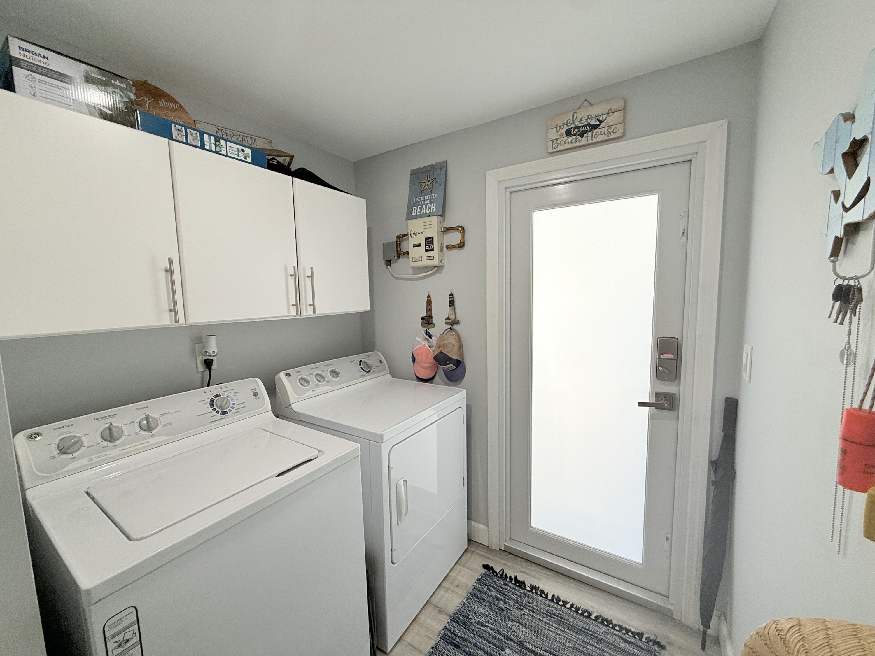 505 Oldsmar Lane Key Largo, FL 33037 - Photo 40 of 58 a utility room with dryer and washer