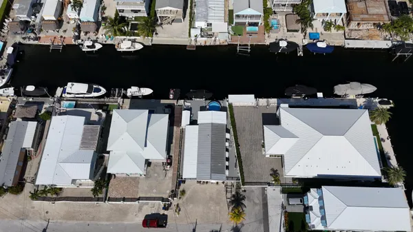 an aerial view of a house with a lake view