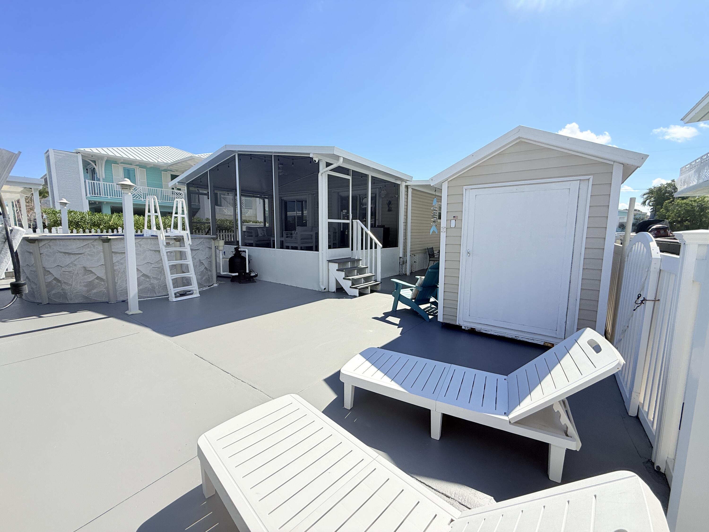 505 Oldsmar Lane Key Largo, FL 33037 - Photo 42 of 58 Backyard, shed, screen terrace