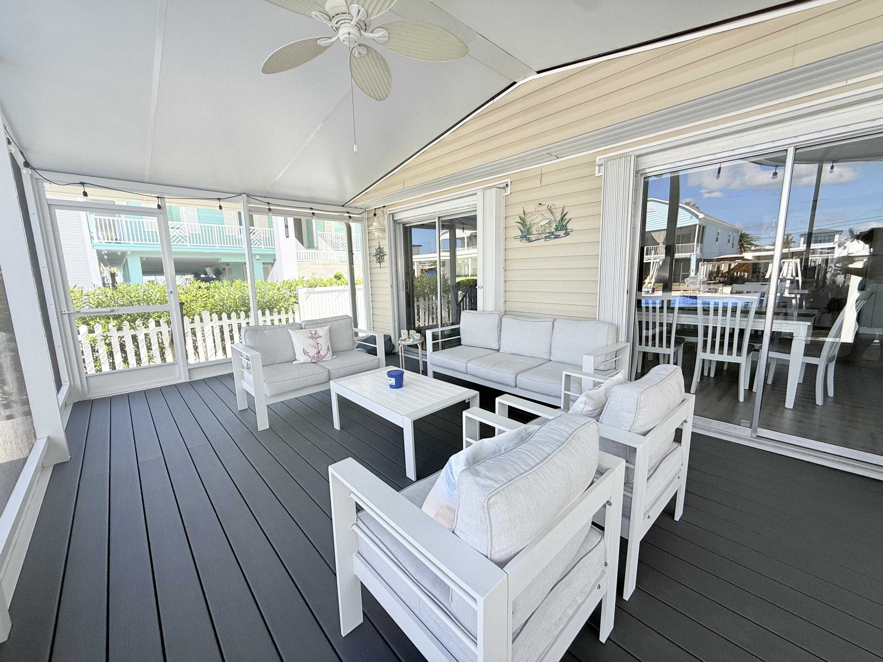 505 Oldsmar Lane Key Largo, FL 33037 - Photo 46 of 61 a living room with furniture and a large window
