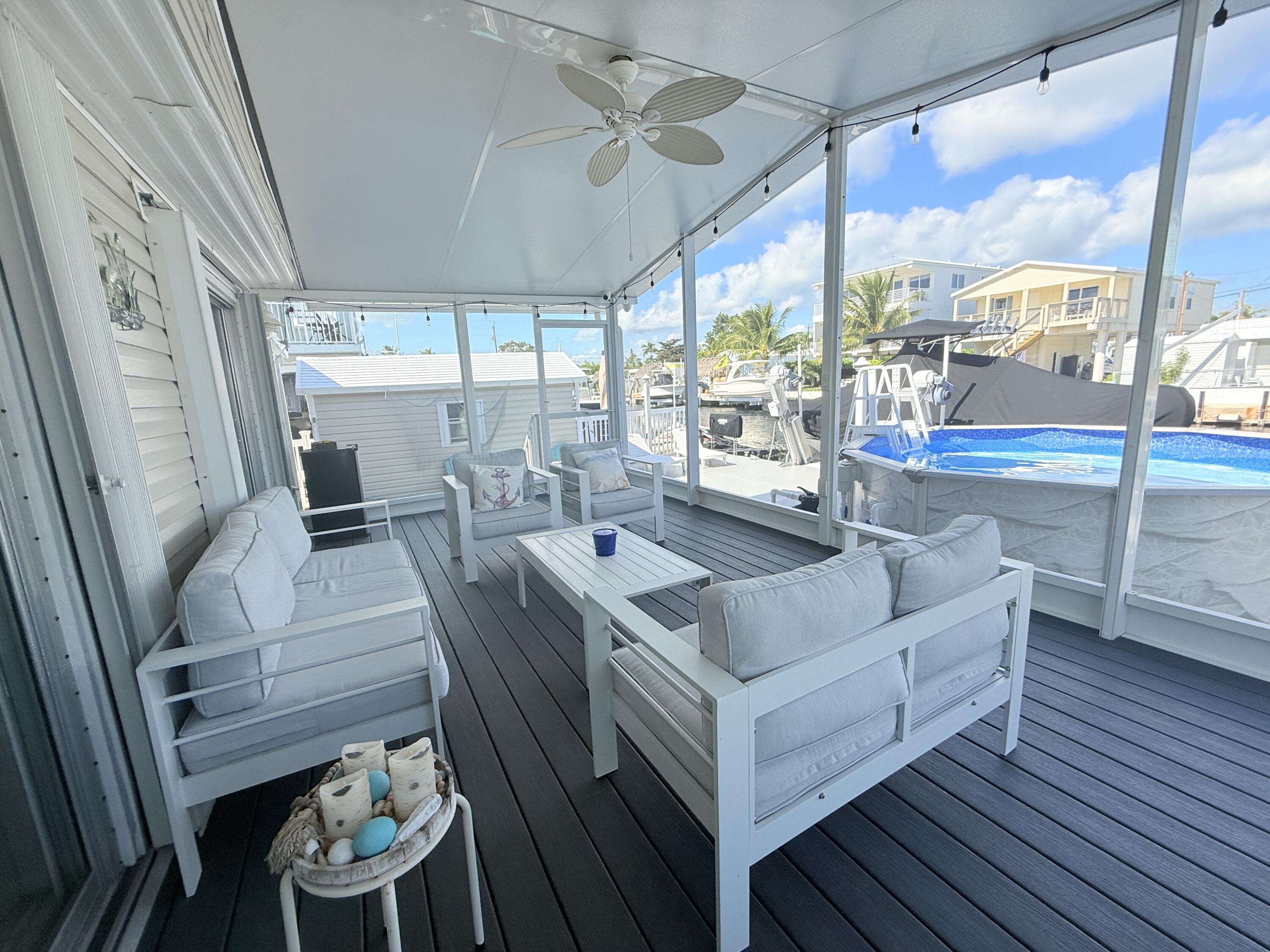 505 Oldsmar Lane Key Largo, FL 33037 - Photo 48 of 61 a living room with furniture and a large window