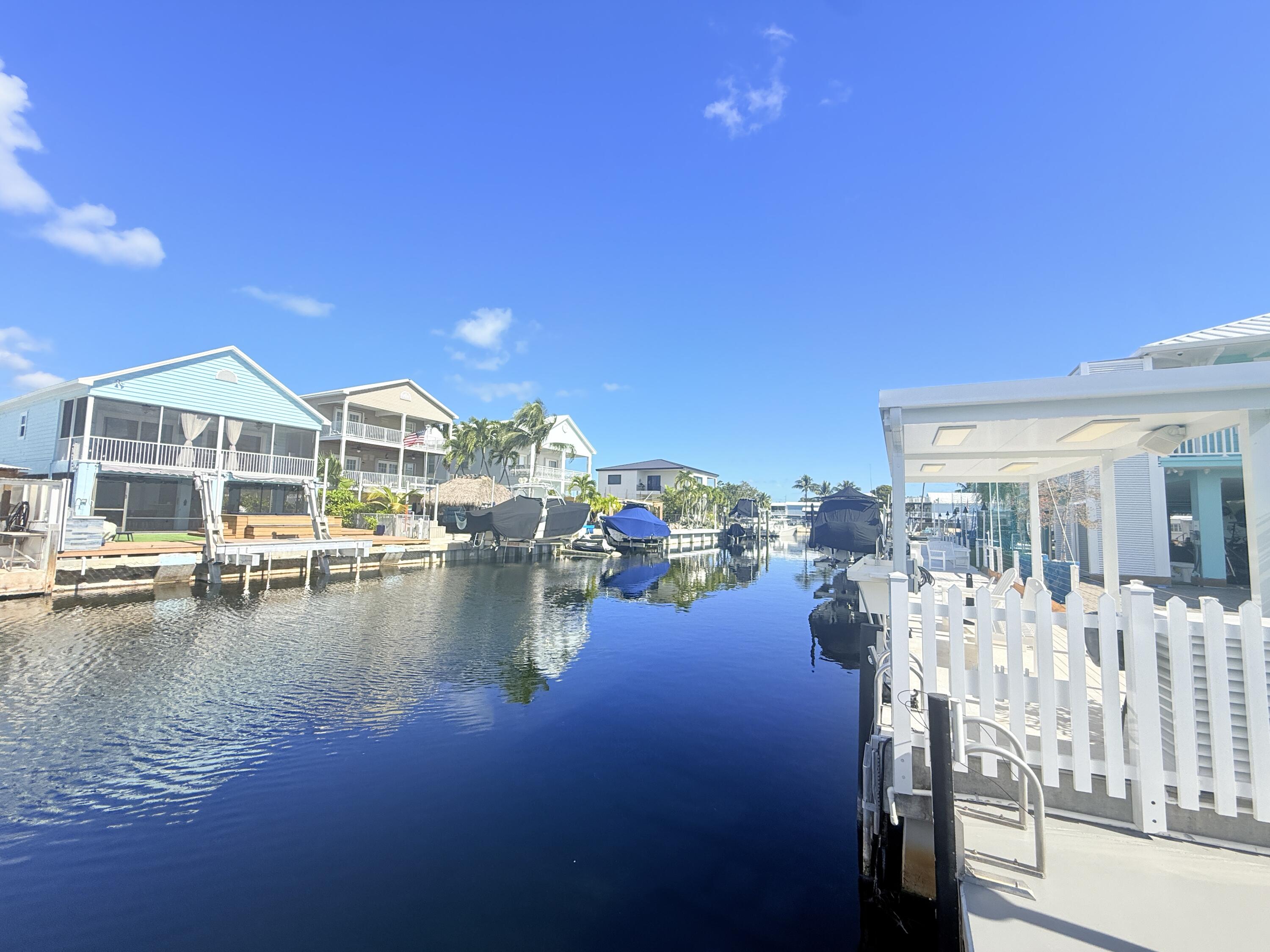 505 Oldsmar Lane Key Largo, FL 33037 - Photo 50 of 61 a view of a swimming pool with outdoor seating