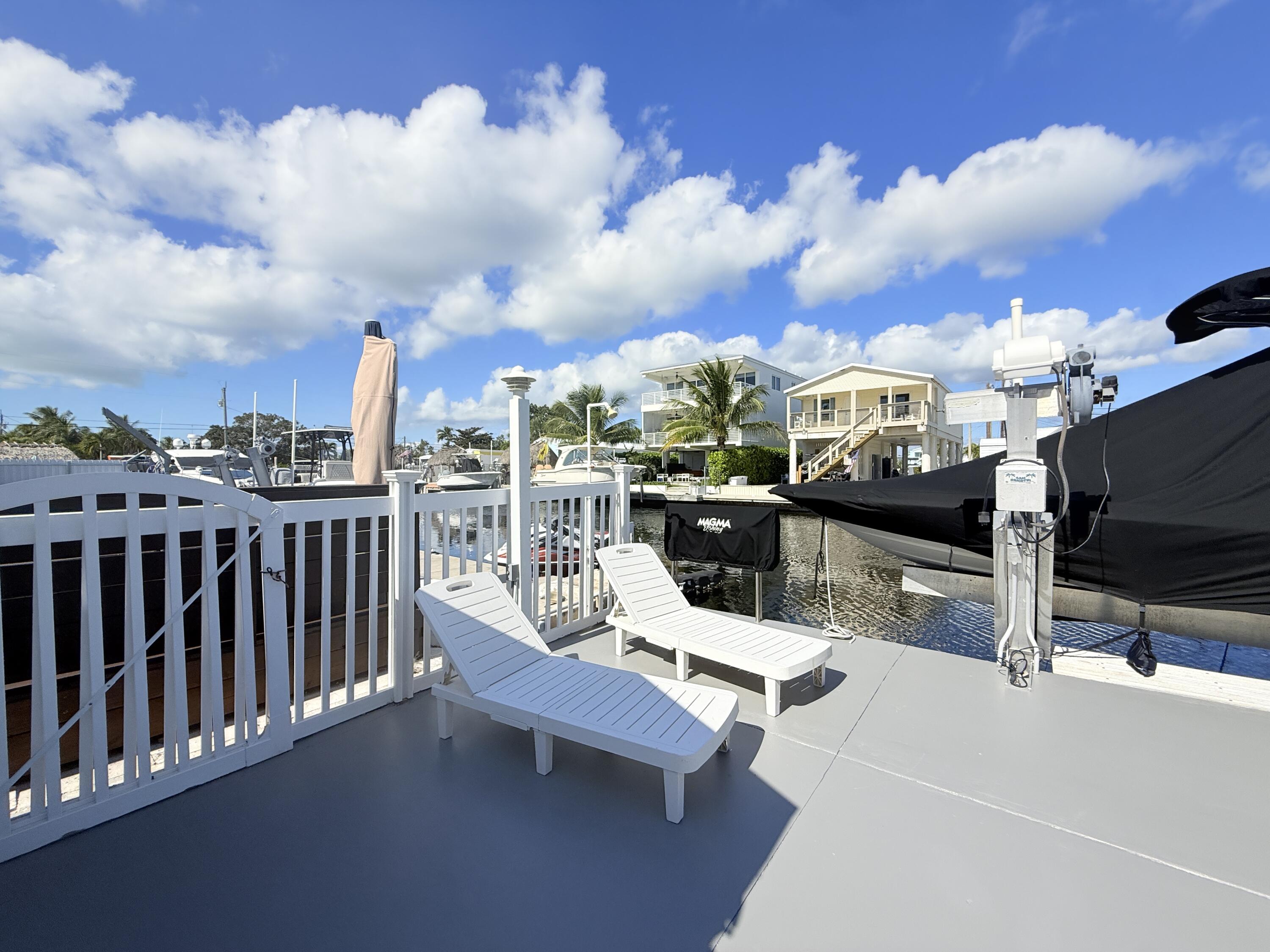 505 Oldsmar Lane Key Largo, FL 33037 - Photo 52 of 58 Back yard and dock