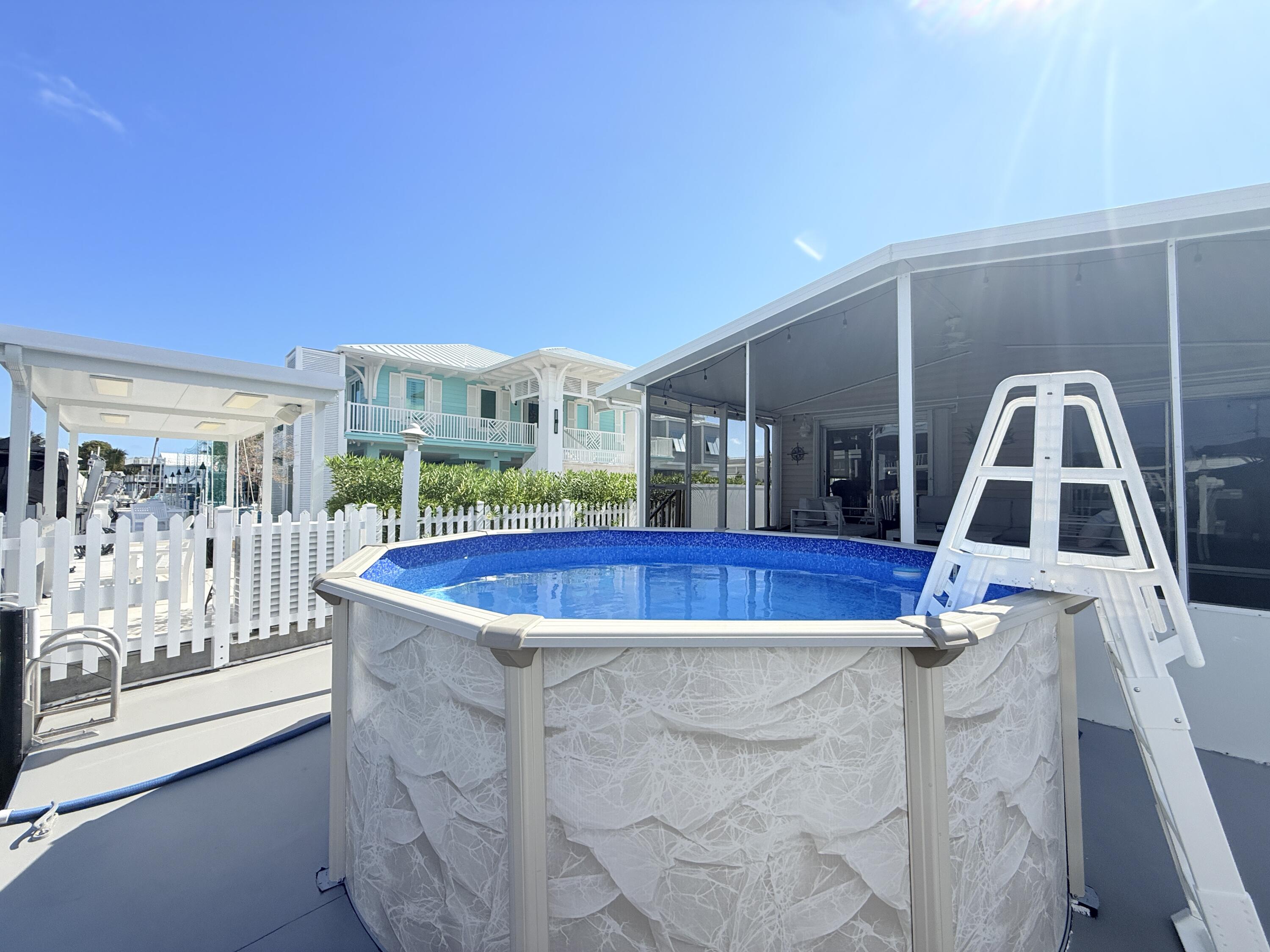 505 Oldsmar Lane Key Largo, FL 33037 - Photo 52 of 61 a view of swimming pool with outdoor seating