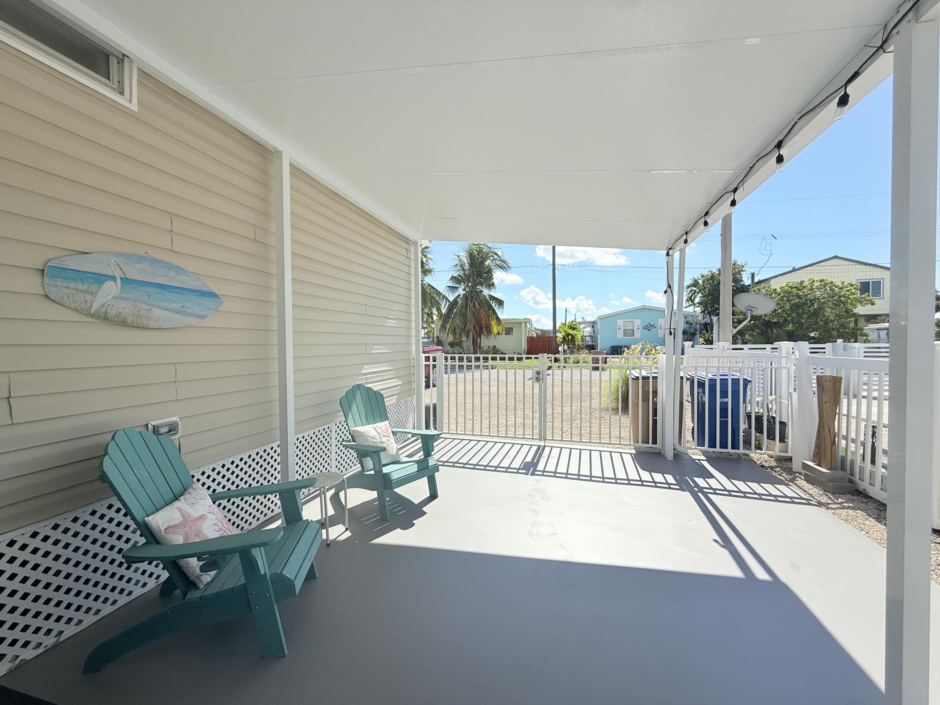 505 Oldsmar Lane Key Largo, FL 33037 - Photo 56 of 61 a view of a chairs and table in the balcony