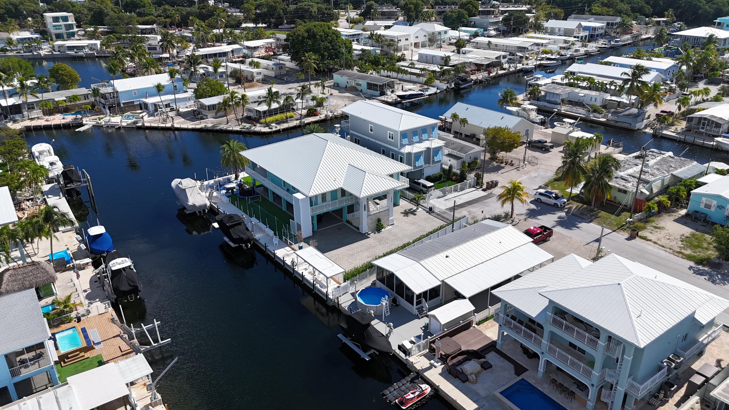 505 Oldsmar Lane Key Largo, FL 33037 - Photo 7 of 61 an aerial view of a house with a lake view