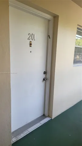 a kitchen with a stove a sink and a refrigerator