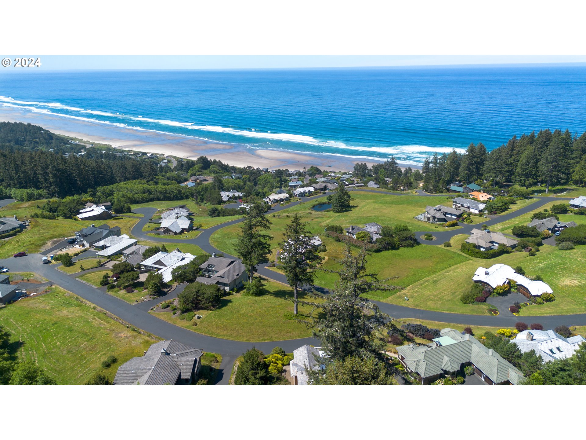 Braeridge Drive, Unit 10 Nehalem, OR 97131 - Photo 6 of 15 a view of a swimming pool yard and outdoor seating