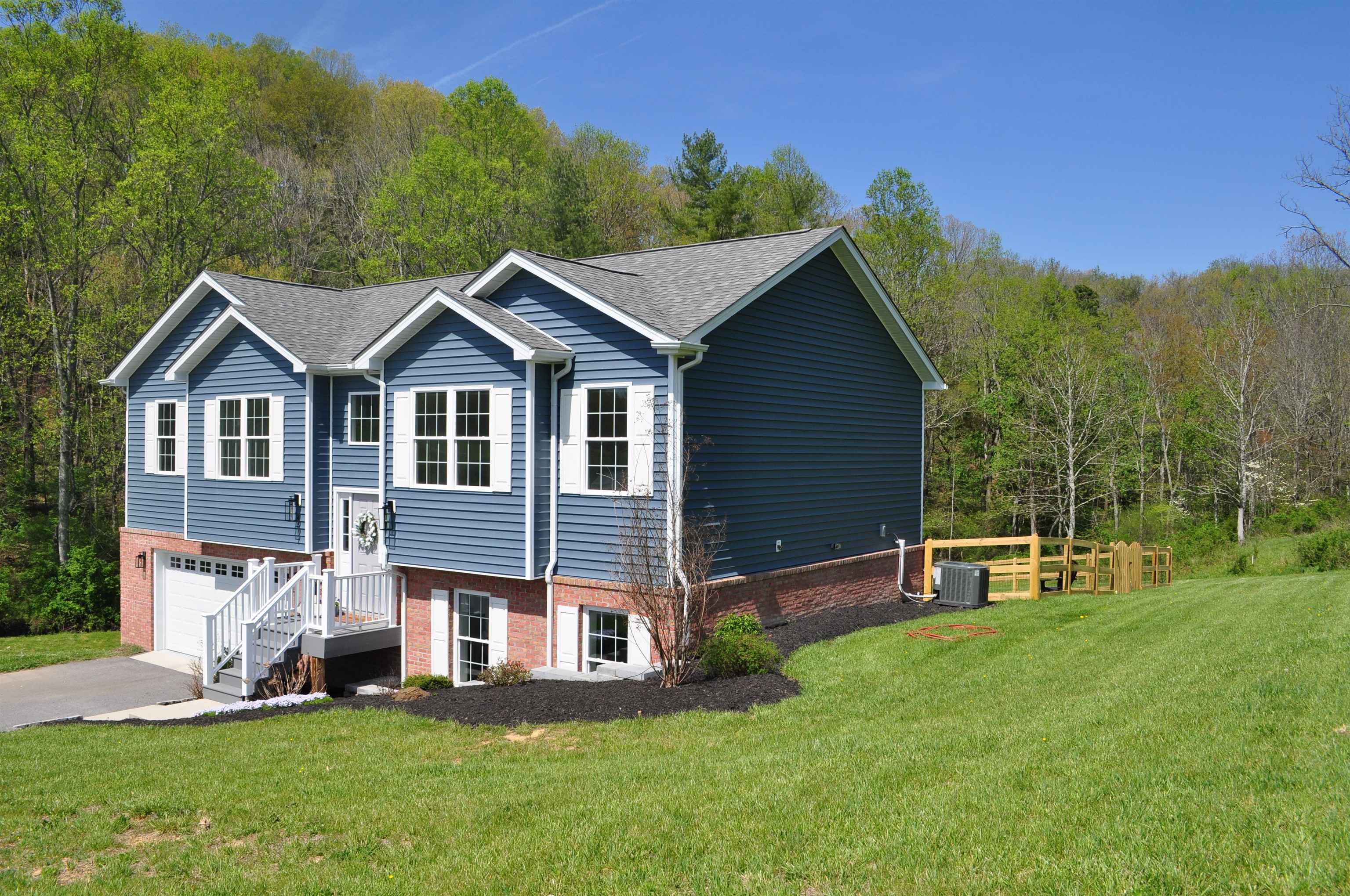 4501 Old Stage Road Radford, VA 24141 - Photo 3 of 55 a front view of a house with a yard