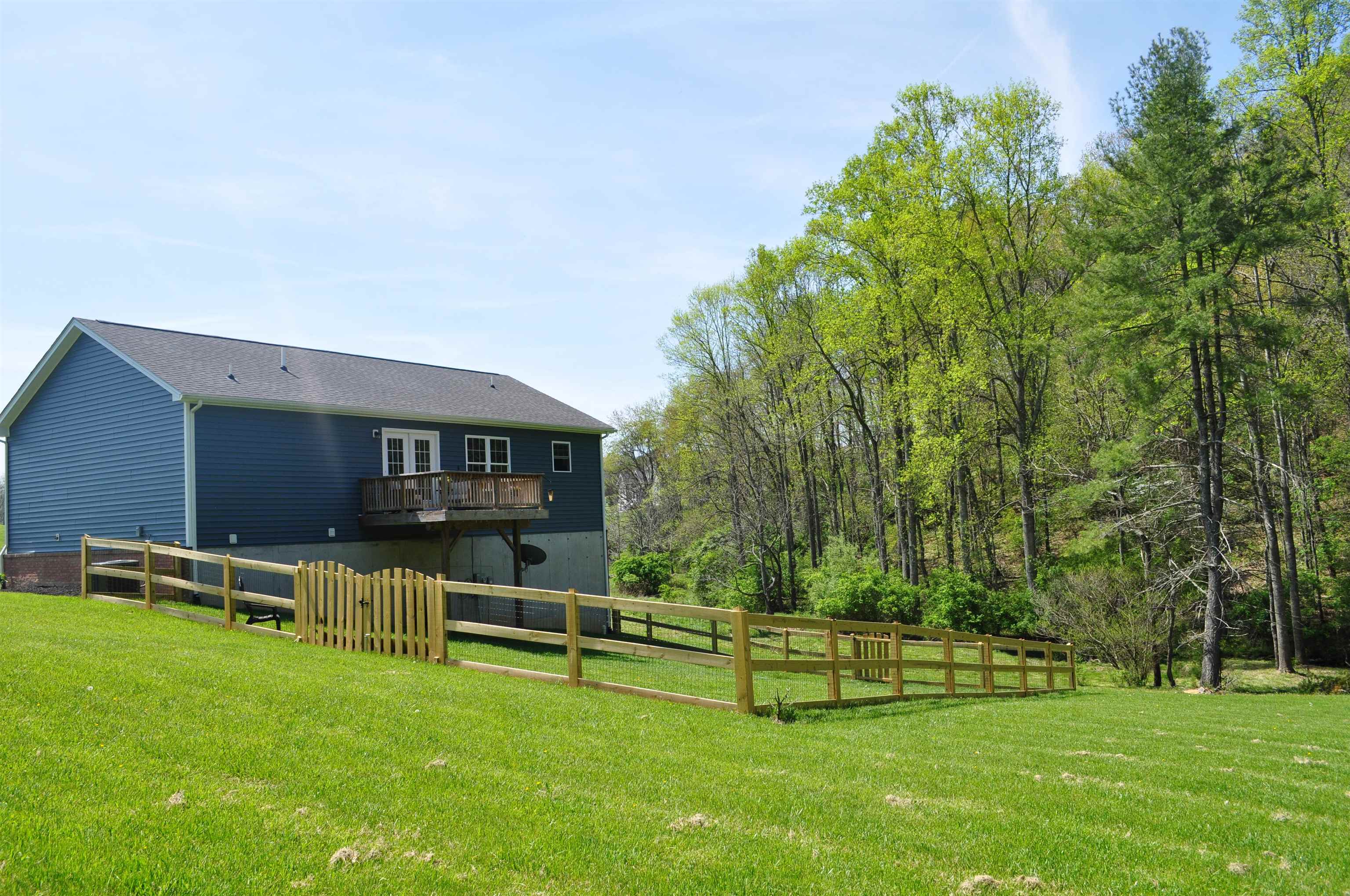 4501 Old Stage Road Radford, VA 24141 - Photo 9 of 55 a view of a house with a backyard