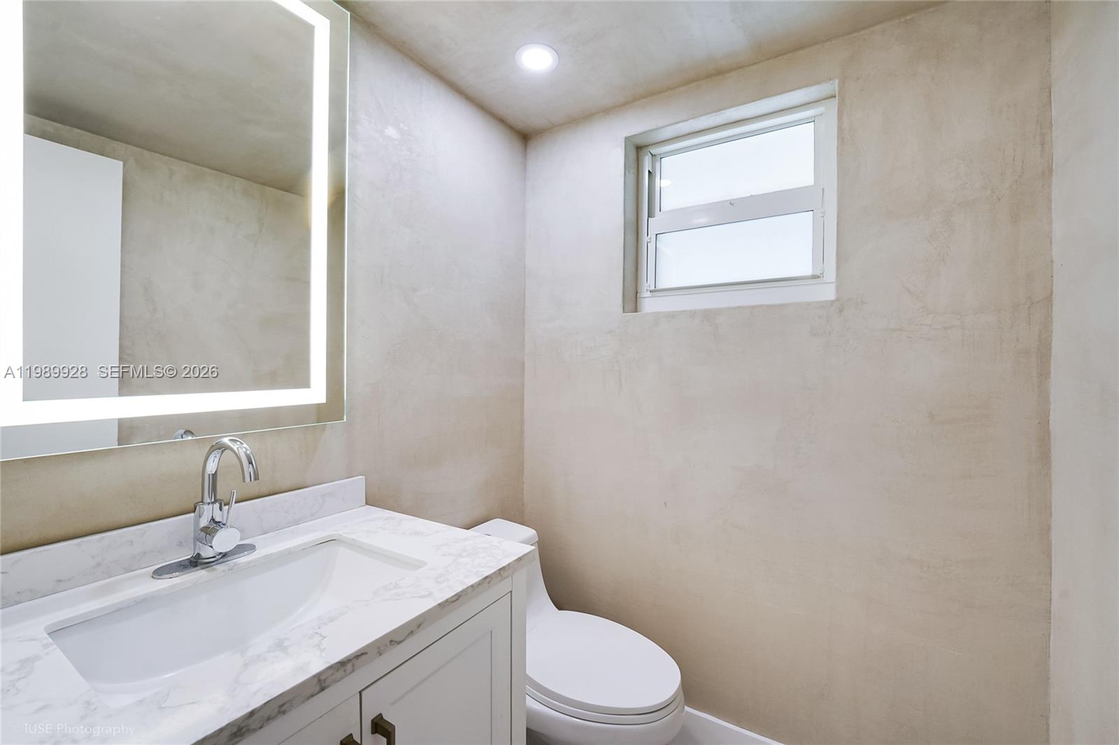 9023 Northeast 4th Avenue Road, Unit 9023 Miami Shores, FL 33138 - Photo 11 of 15 a bathroom with a sink toilet vanity and tub