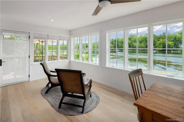 a view of a dining room with furniture window and outside view