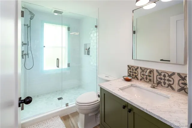 a view of a hallway with seating area