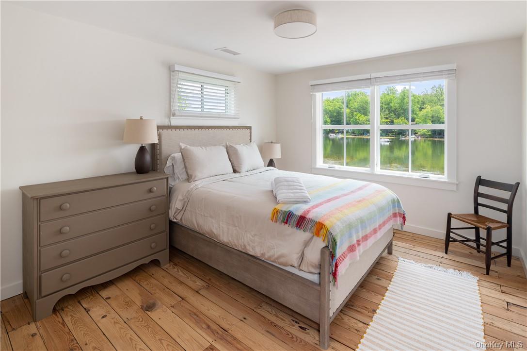 24 Cove Road South Salem, NY 10590 - Photo 19 of 26 a bedroom with a bed wooden floor and window