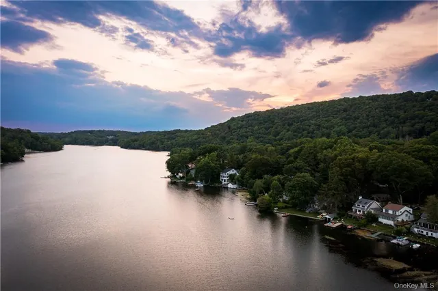 a view of a chairs and table in the balcony
