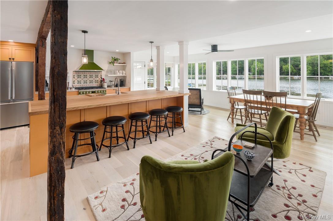 24 Cove Road South Salem, NY 10590 - Photo 7 of 26 a dining room with furniture a chandelier and wooden floor
