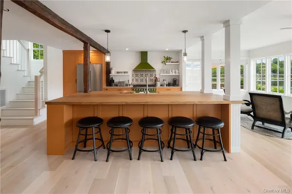 a dining room with furniture and wooden floor